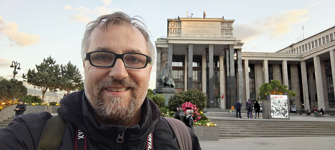 The author standing in front of a grand Moscow building, reflecting the city’s impressive architectural style.