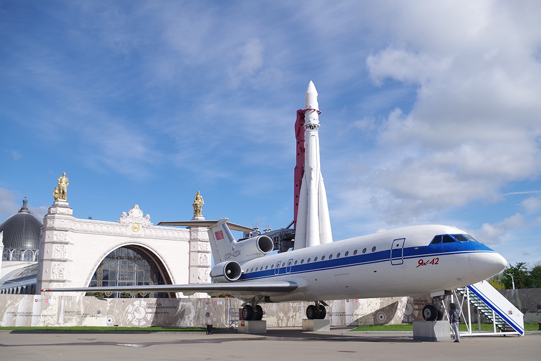 A jet and rocket displayed outside a museum building, highlighting Russia’s technological heritage.