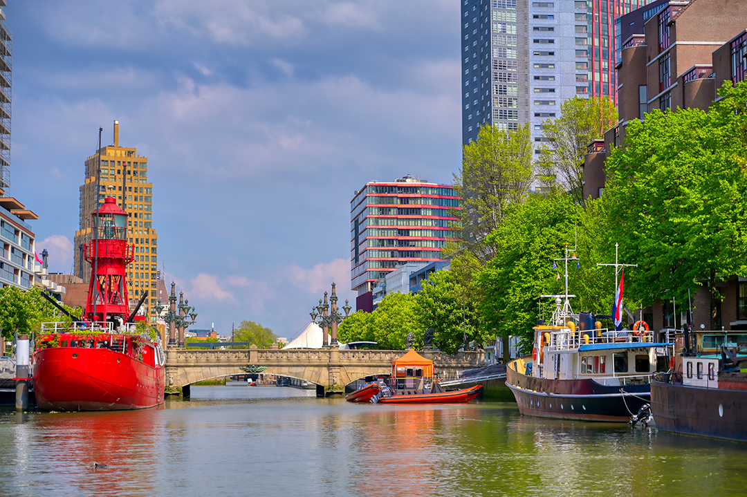 Rotterdam’s waterfront blending innovative architecture with its dynamic port atmosphere.