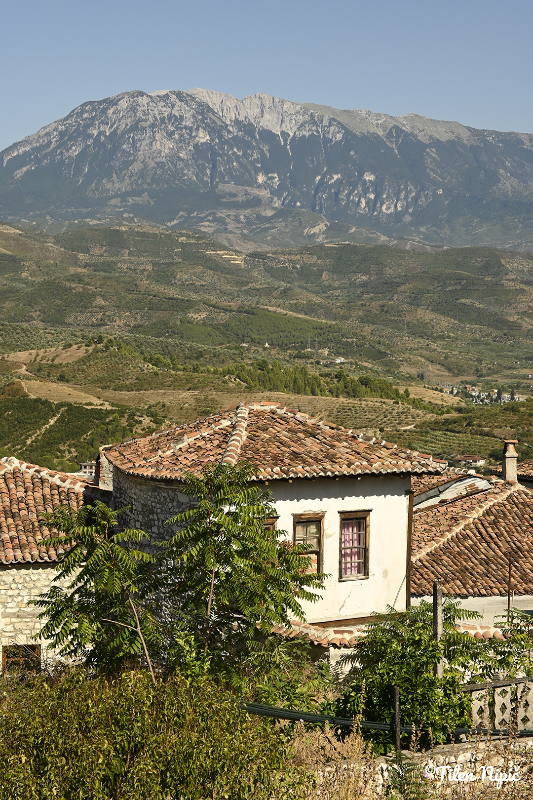 A view of the Albanian landscape with mountains in the background highlights natural diversity.