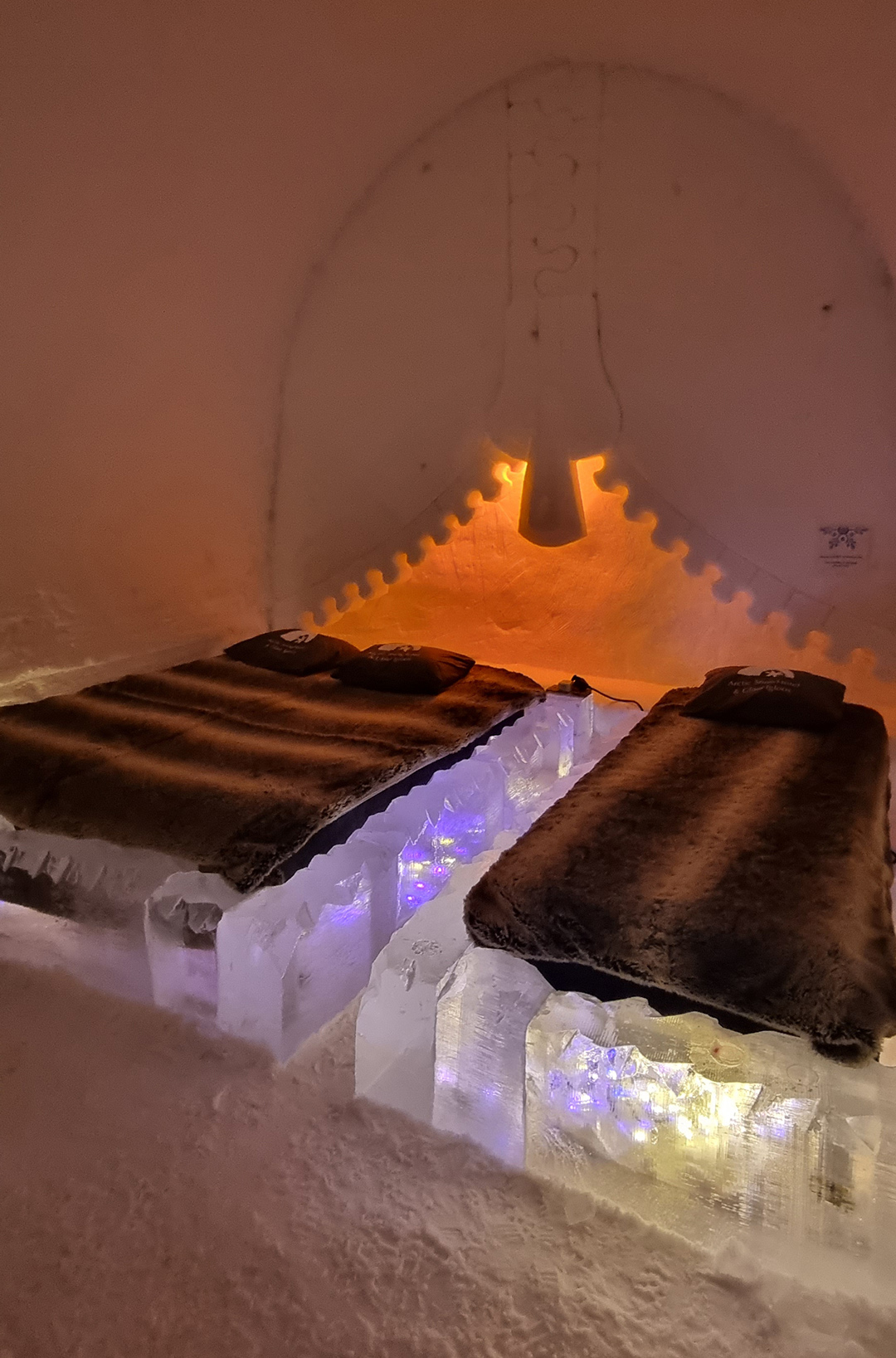 Ice room inside the Arctic SnowHotel near Rovaniemi, where beds, walls and decorations are rebuilt every year entirely from ice and snow.