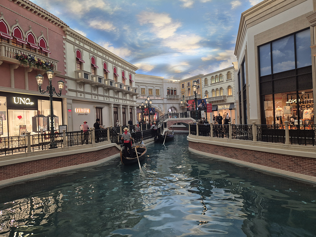 Indoor canals of the Venetian resort in Las Vegas, recreating Venice with gondolas and architecture for a unique shopping and travel experience.