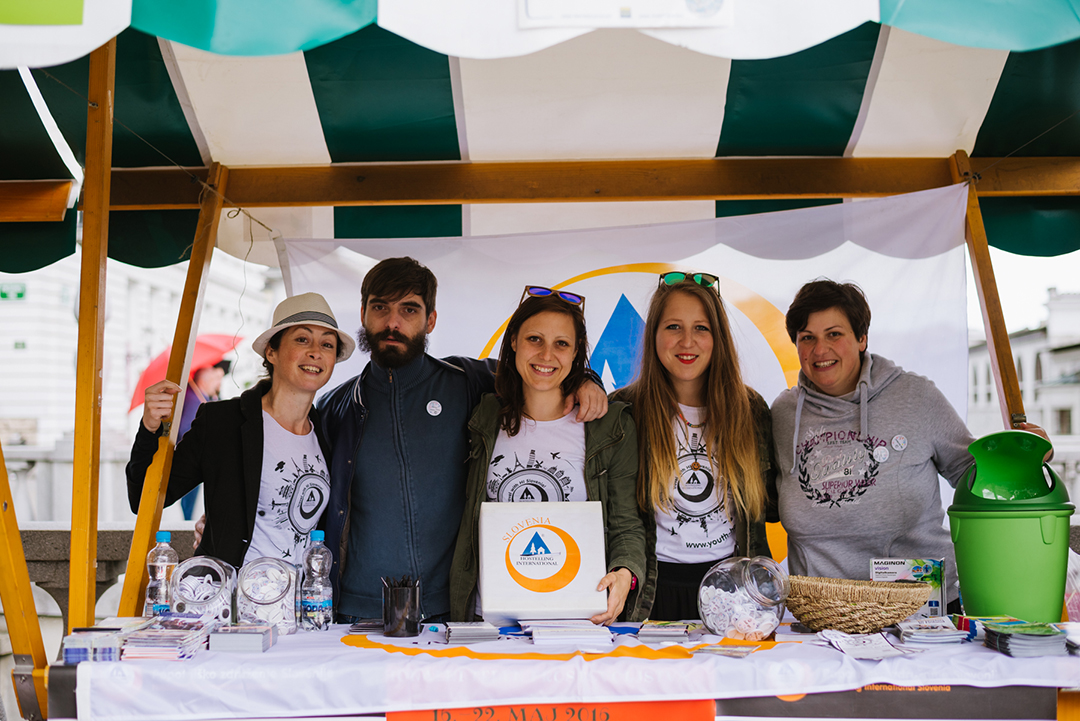 Volunteers of Hostelling International Slovenia presenting programmes, projects and opportunities for involvement at an information stand.