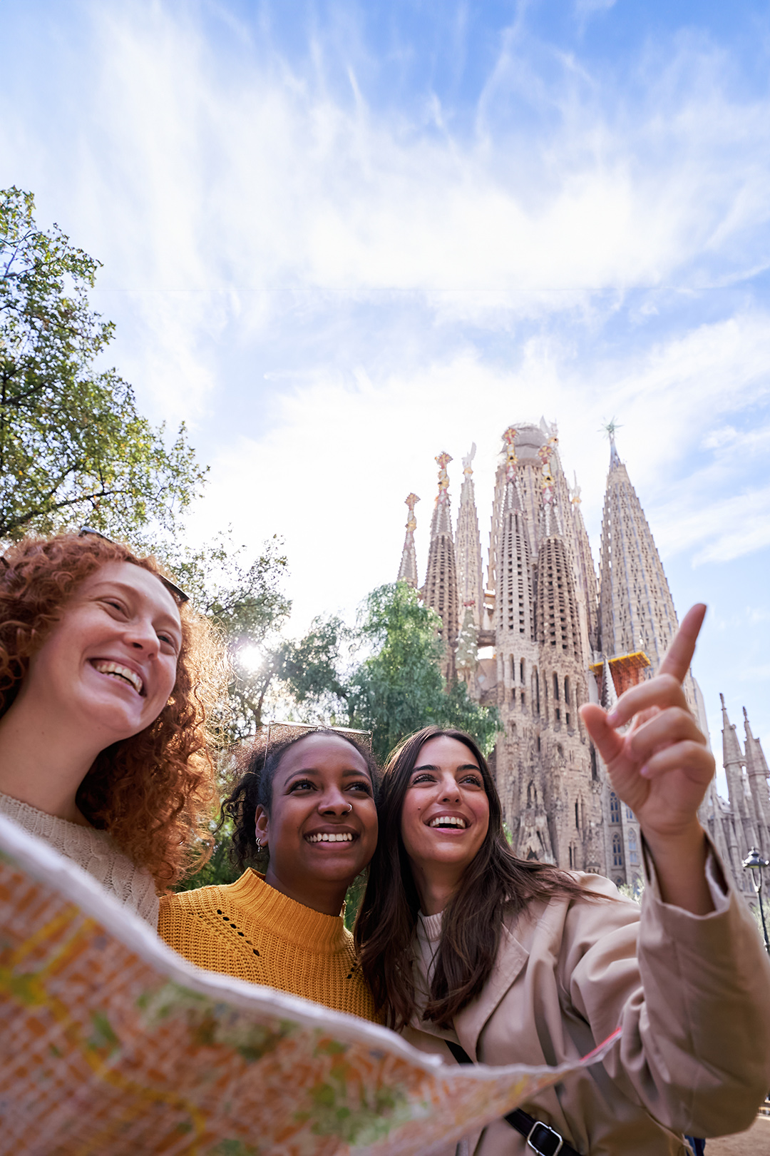 A group of travelers in front of the Sagrada Família experience one of Barcelona’s most iconic landmarks.