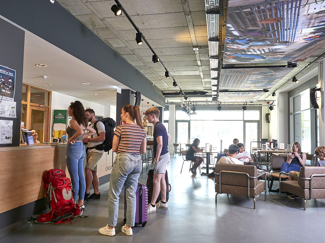 Reception area of a youth hostel in Esch-sur-Alzette where travellers check in and socialise.